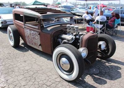 1930 Ford Model A Tudor Hot Rod with a vintage appearance, showcasing classic car restoration and customization at an outdoor event.